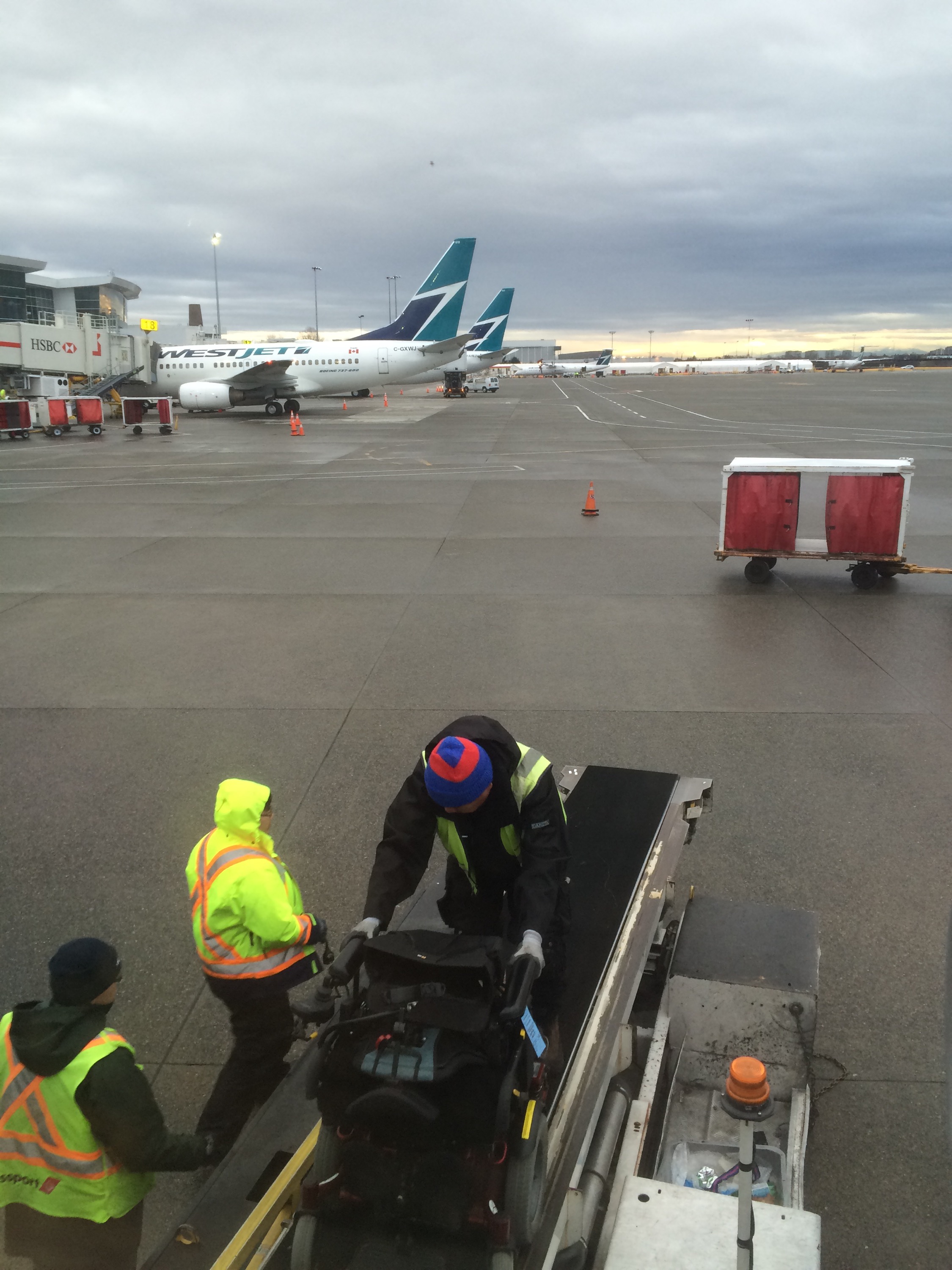 My chair being manhandled off the plane