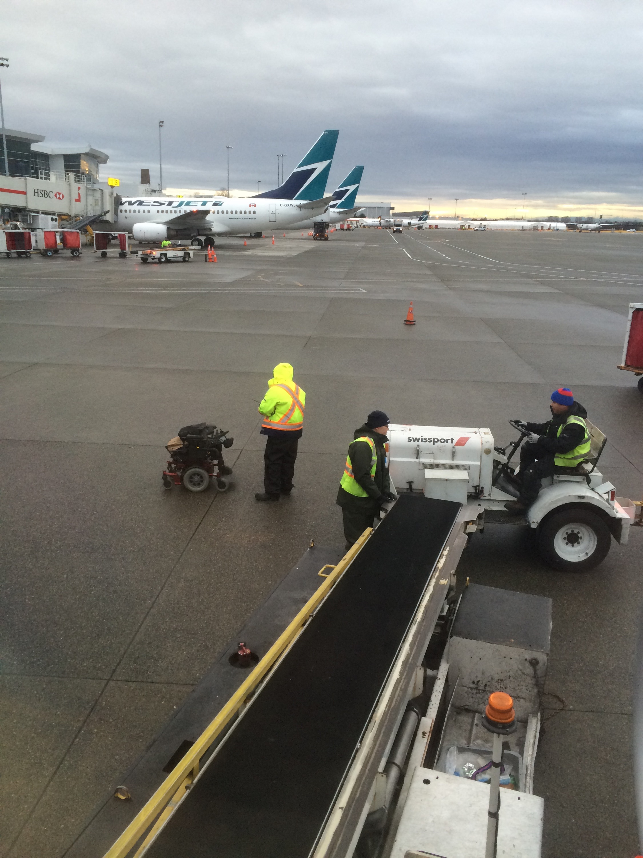 My chair on the runway in the rain, getting wet