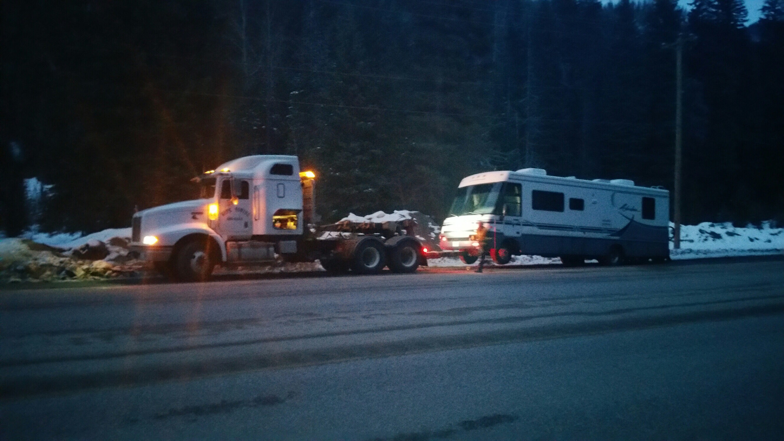 Winnebago hooked up to the tow truck