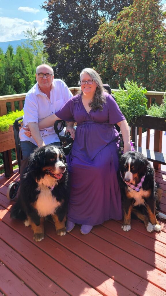 Victor, Michelle, on their wedding day with Lacey and Deefer, their Bernese Mountain dogs