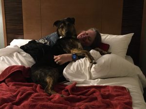 On the bed in the hotel room for the first night, Michelle and Leo.